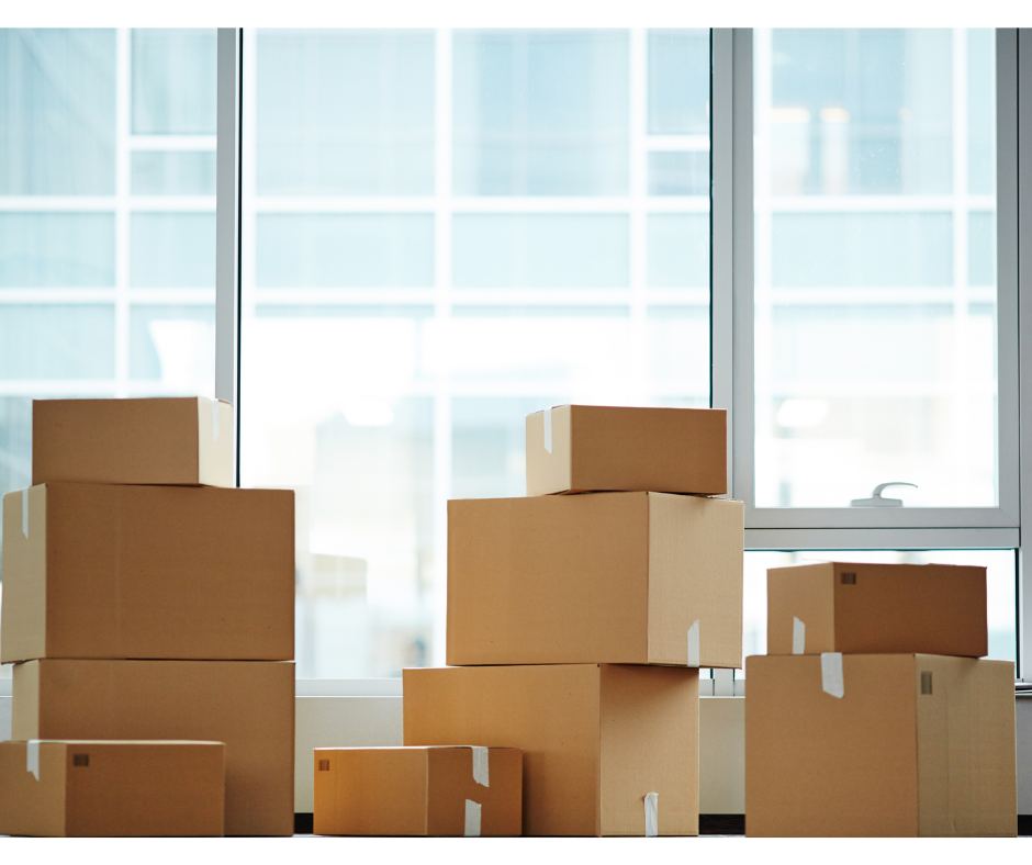 Stack of moving boxes and packing materials.